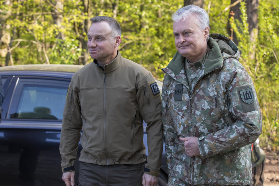 Lithuania's President Gitanas Nauseda and Poland's President Andrej Duda, left, arrive to attend in the Lithuanian-Polish Brave Griffin 24/II military exercise near the Suwalki Gap near the Polish border at the Dirmiskes village, Alytus district west of the capital Vilnius in Lithuania on Friday, April 26, 2024. Over 1500 troops and 200 pieces of tactical equipment are rehearsing defence scenarios under the bilateral Lithuanian-Polish Orsha Plan near the Suwalki Gap. (AP Photo/Mindaugas Kulbis)