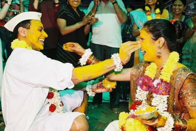 The author and her husband during the Pitti ceremony at their wedding in 2005. (Photo: Courtesy of Anita Vijayakumar)