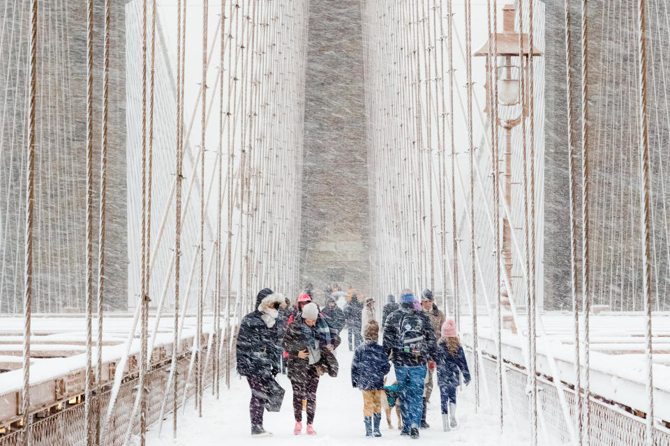 The Brooklyn Bridge in Manhattan, New York, during a winter 'whiteout'