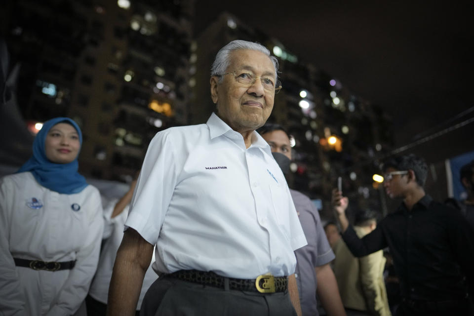 Two-time former Malaysian Prime Minister and Gerakan Tanah Air, or Homeland Movement Chairman Mahathir Mohamad arrives at a rally for his party in Kuala Lumpur, Malaysia, Tuesday, Nov. 15, 2022. At 97, Mahathir is back again in the election race as the head of a new ethnic Malay alliance that he calls a "movement of the people." He hopes his bloc could gain enough seats in Nov. 19 polls to be a powerbroker. (AP Photo/Vincent Thian)