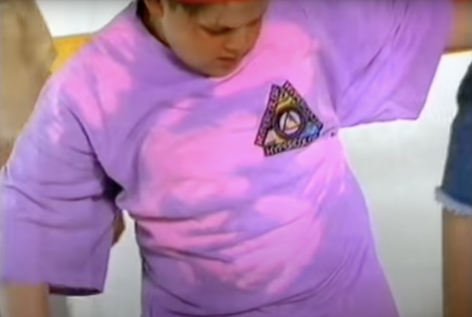 a boy wearing a hypercolor shirt