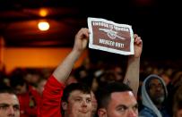 <p>An Arsenal fan protests about Arsene Wenger</p>