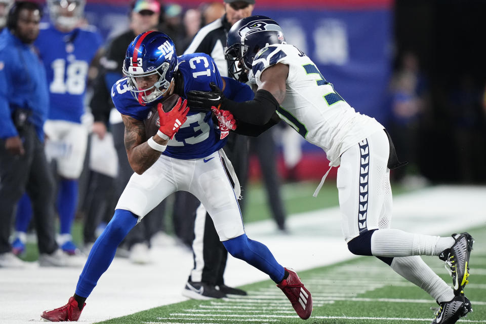 New York Giants wide receiver Jalin Hyatt (13) is forced out of bounds by Seattle Seahawks cornerback Michael Jackson (30) during the fourth quarter of an NFL football game, Monday, Oct. 2, 2023, in East Rutherford, N.J. (AP Photo/Frank Franklin II)