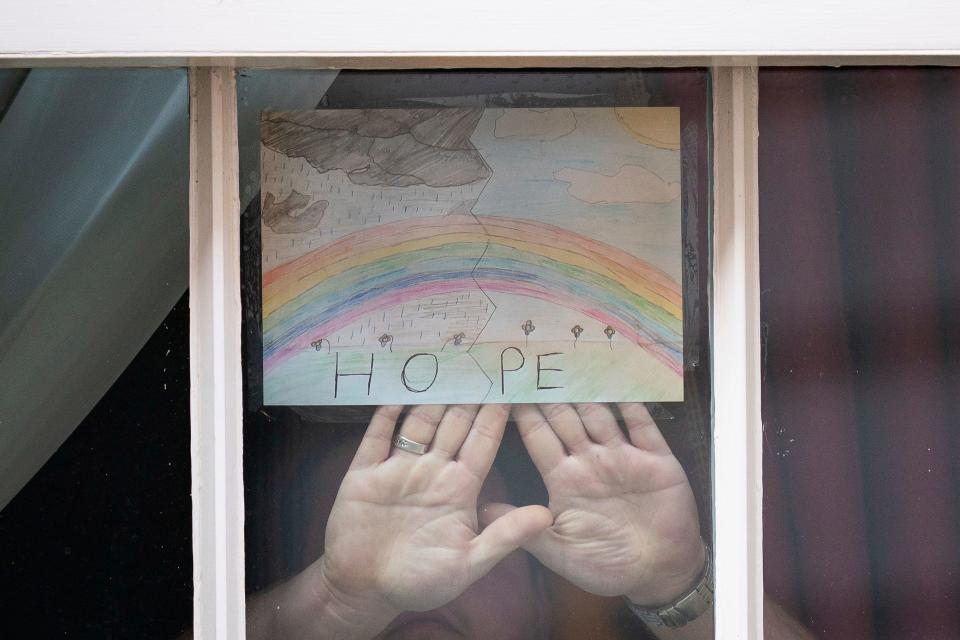A drawing of a rainbow with the word "Hope" by Logan age 6 is displayed in one of the windows of 10 Downing Street, London, as Prime Minister Boris Johnson remains in hospital following his admission on Sunday with continuing coronavirus symptoms Thursday April 9, 2020. The highly contagious COVID-19 coronavirus has impacted on nations around the globe, many imposing self isolation and exercising social distancing when people move from their homes. (Aaron Chown/PA via AP)