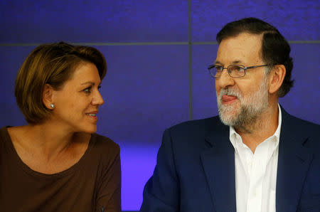 Spain's acting Prime Minister and People's Party (PP) leader Mariano Rajoy (R) presides over an executive committee meeting next to Maria Dolores de Cospedal at the party headquarters in Madrid, Spain, August 17, 2016. REUTERS/Javier Barbancho