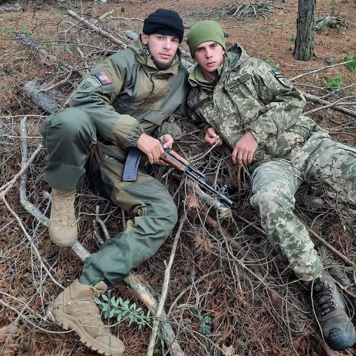 Georgiy Roshka (left) with a fellow soldier before his arm was amputated (Georgiy Roshka/PA)