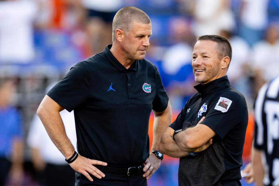 Sep 9, 2023; Gainesville, Florida; Florida Gators head coach Billy Napier talks with McNeese State Cowboys head coach Gary Goff before the game at Ben Hill Griffin Stadium. Matt Pendleton-USA TODAY Sports