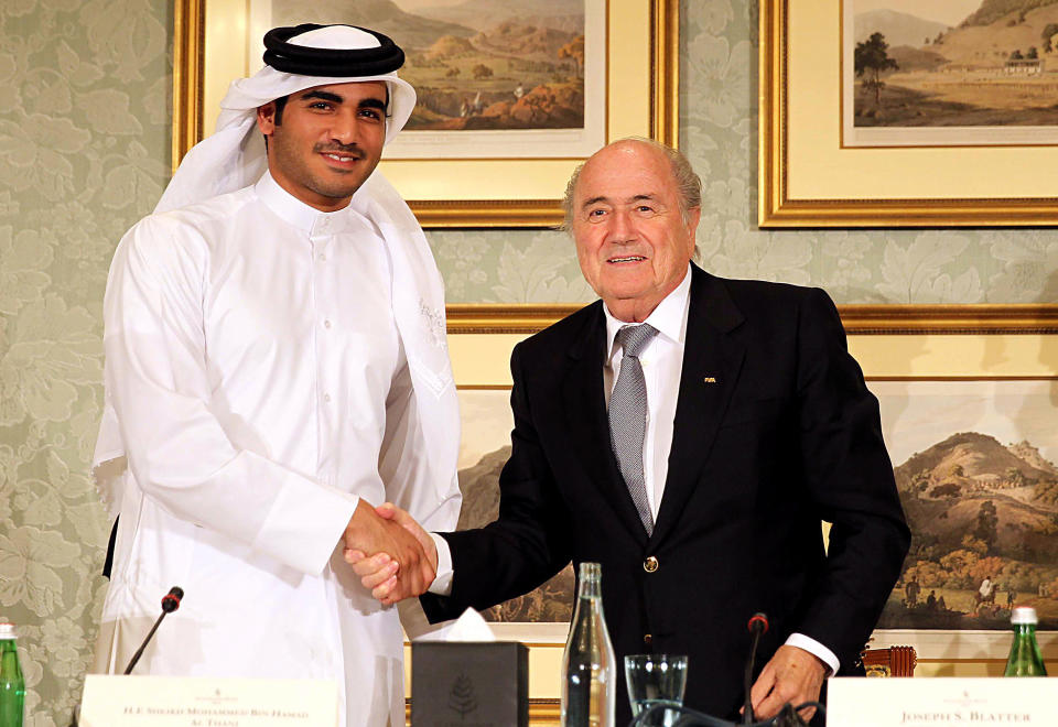 DOHA, QATAR - NOVEMBER 9: FIFA President Sepp Blatter (R) and the Chairman of Qatar 2022 bid committee Sheik Mohammed bin Hamad al-Thani (L) hold a press conference on November 9, 2013 in Doha, Qatar. Blatter mentioned, he would favour playing the 2022 Qatar World Cup in November and December. (Photo By Mohamed Farag/Anadolu Agency/Getty Images)