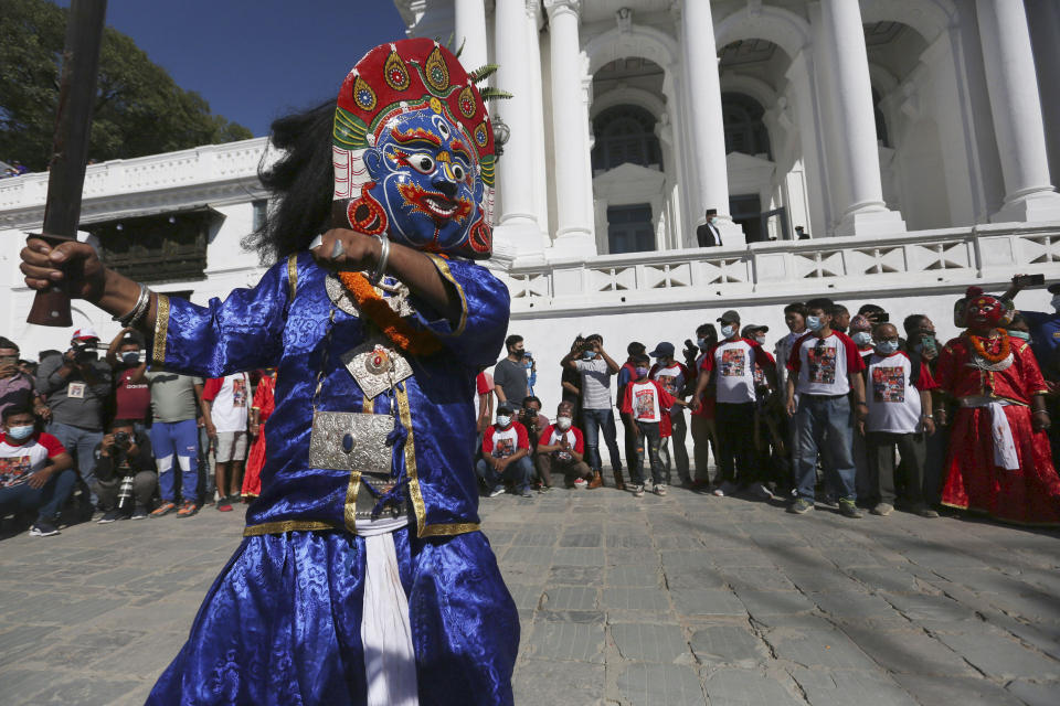 Masked dancers perform during the annual Indra Jatra festival in Kathmandu, Nepal, Sunday, Sept. 19, 2021. The feast of Indra Jatra marks the return of the festival season in the Himalayan nation two years after it was scaled down because the pandemic. (AP Photo/Niranjan Shrestha)