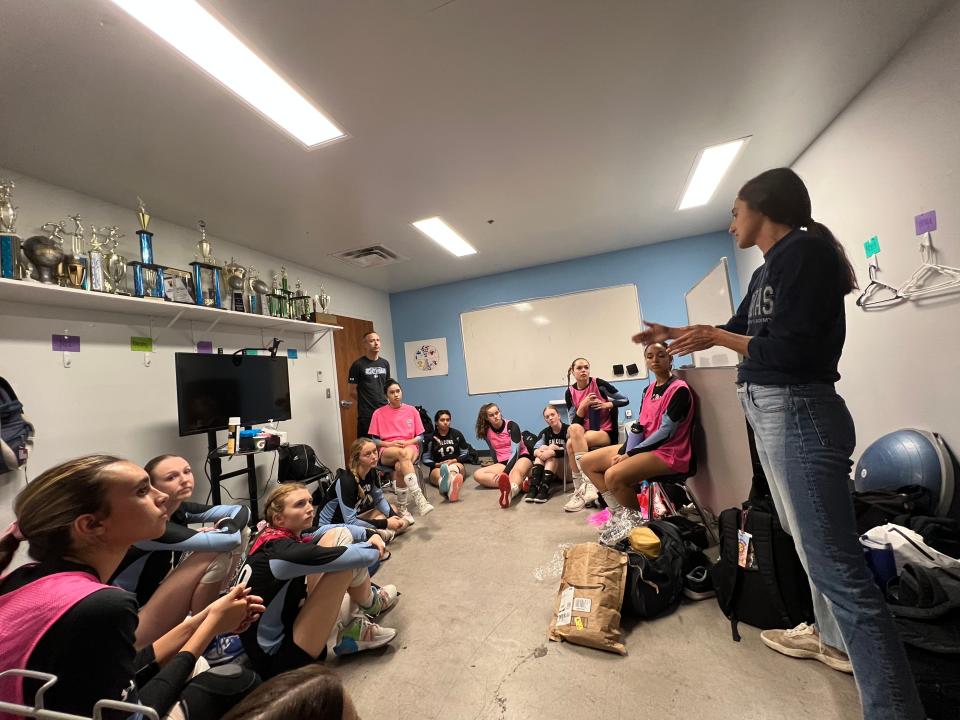 Beach volleyball Olympian Sarah Sponcil meets with members of the girls varsity volleyball team at Veritas Prep Academiy, where Sponcil starred on the volleyball team.