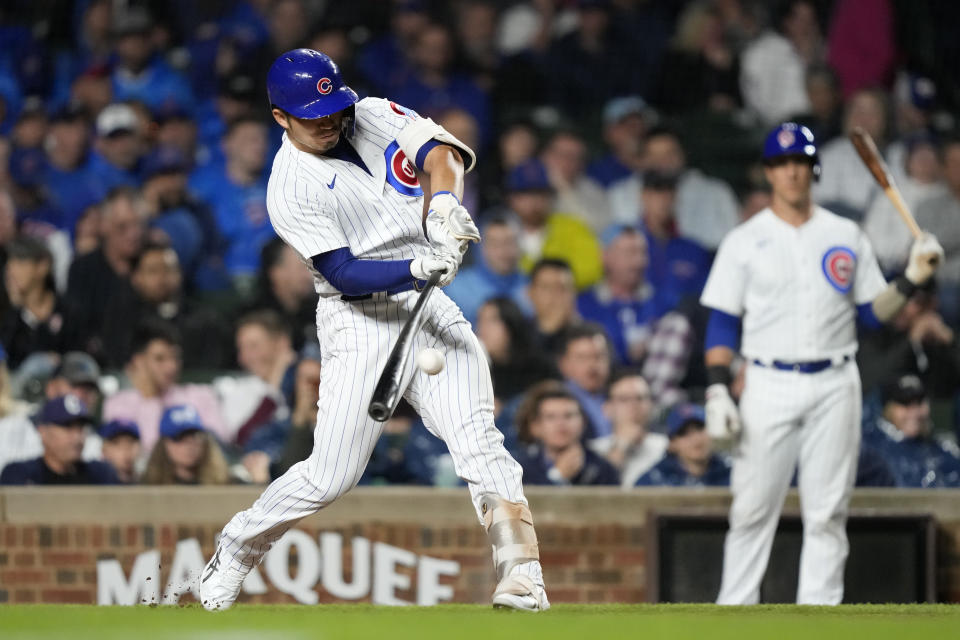 Chicago Cubs' Seiya Suzuki hits a single off Pittsburgh Pirates relief pitcher Quinn Priester during the fifth inning of a baseball game Tuesday, Sept. 19, 2023, in Chicago. (AP Photo/Charles Rex Arbogast)