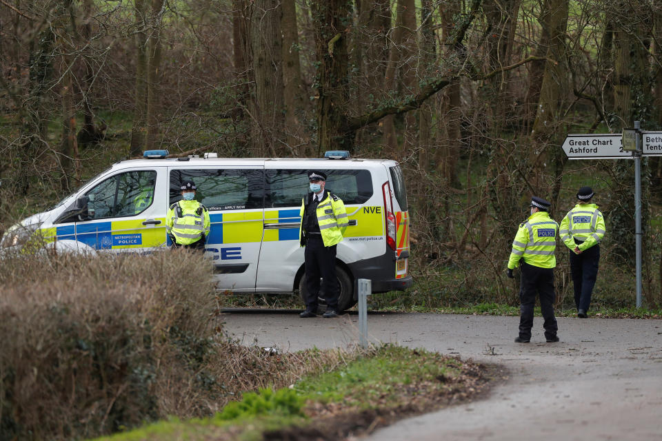 Image: Police officers stand outside the Great Chart Golf & Leisure Country Club, as the investigation into the disappearance of Sarah Everard continues, in Ashford, Britain (Paul Childs / Reuters)