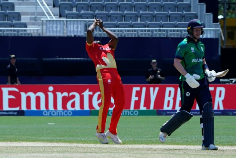 Key blow: Jeremy Gordon catches Mark Adair off his own bowling during <a class="link " href="https://sports.yahoo.com/soccer/teams/canada-women/" data-i13n="sec:content-canvas;subsec:anchor_text;elm:context_link" data-ylk="slk:Canada;sec:content-canvas;subsec:anchor_text;elm:context_link;itc:0">Canada</a>'s 12-run T20 World Cup win over <a class="link " href="https://sports.yahoo.com/soccer/teams/republic-of-ireland-women/" data-i13n="sec:content-canvas;subsec:anchor_text;elm:context_link" data-ylk="slk:Ireland;sec:content-canvas;subsec:anchor_text;elm:context_link;itc:0">Ireland</a> in New York (TIMOTHY A. CLARY)