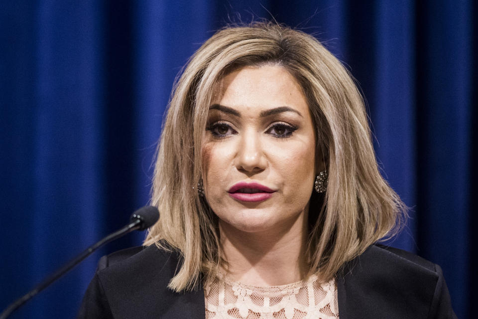 FILE--In this Thursday, Feb. 21, 2019, file photo, Solicitor General Fadwa Hammoud speaks during a press conference at the Frank Kelley Law Library in the Williams Building in Lansing, Mich. Authorities investigating Flint's water crisis have seized from storage the state-owned mobile devices of Snyder and 65 other current or former officials. Hammoud and Wayne County Prosecutor Kym Worthy confirmed they executed a series of search warrants related to the criminal investigation of Flint's lead-contaminated water and a deadly outbreak of Legionnaires' disease. (Jake May/The Flint Journal via AP, File)