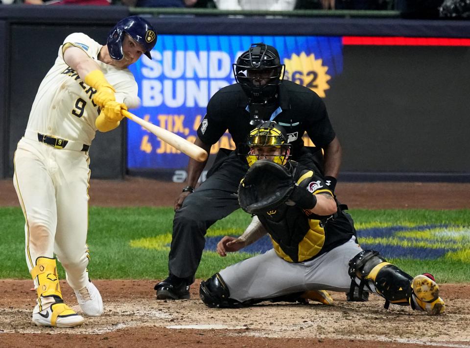 The Brewers' Jake Bauers hits a grand slam home run during the eighth inning against the Pirates on Monday night.