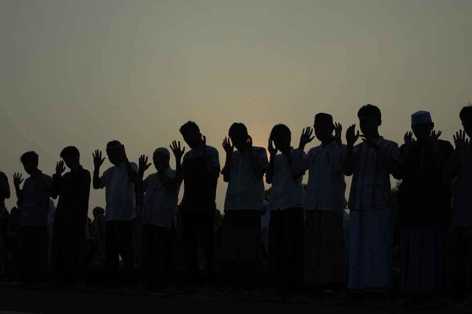 Muslims perform Eid al-Adha prayer on a street in Jakarta, Indonesia, Monday, June 17, 2024. Muslims around the world celebrate Eid al-Adha by sacrificing animals to commemorate the prophet Ibrahim's faith in being willing to sacrifice his son. (AP Photo/Achmad Ibrahim)