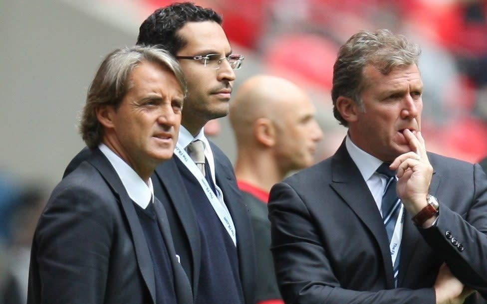 Manchester City's former manager Roberto Mancini (left) with owner Sheikh Mansour, centre, and former chief executive Gary Cook at the 2011 Community Shield