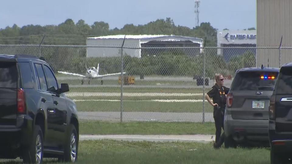 Two police officers shot an armed man who wanted to board a plane Friday morning at the Melbourne Orlando International Airport, the Melbourne Airport Police Department said.