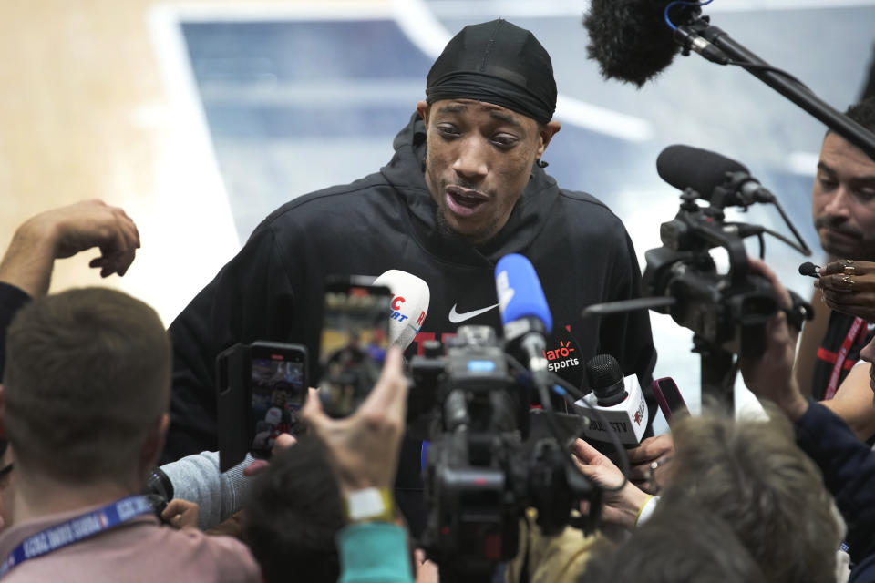 Chicago Bulls DeMar DeRozan answers reporters after a training session on the eve of the NBA basketball game between Chicago Bulls and Detroit Pistons, in Levallois-Perret, outside Paris, Wednesday, Jan. 18, 2023. (AP Photo/Christophe Ena)
