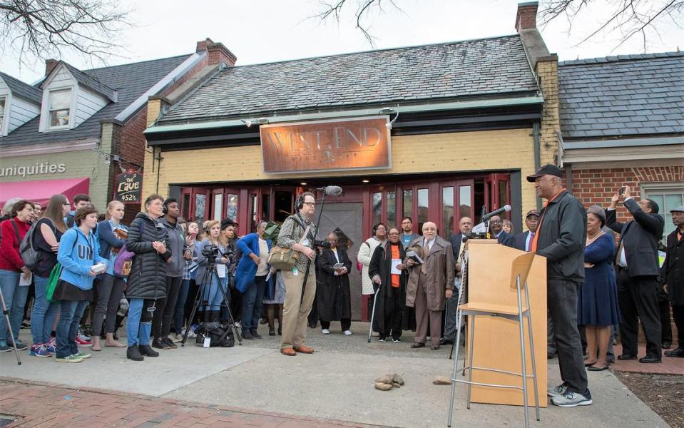 A crowd gathered on March 28, 2019, outside the West End Wine Bar on Franklin Street to hear the story of the Chapel Hill Nine and the town’s plan for a new marker to honor that history. The site is the former Colonial Drug Store, where the teens held a sit-in in 1960.