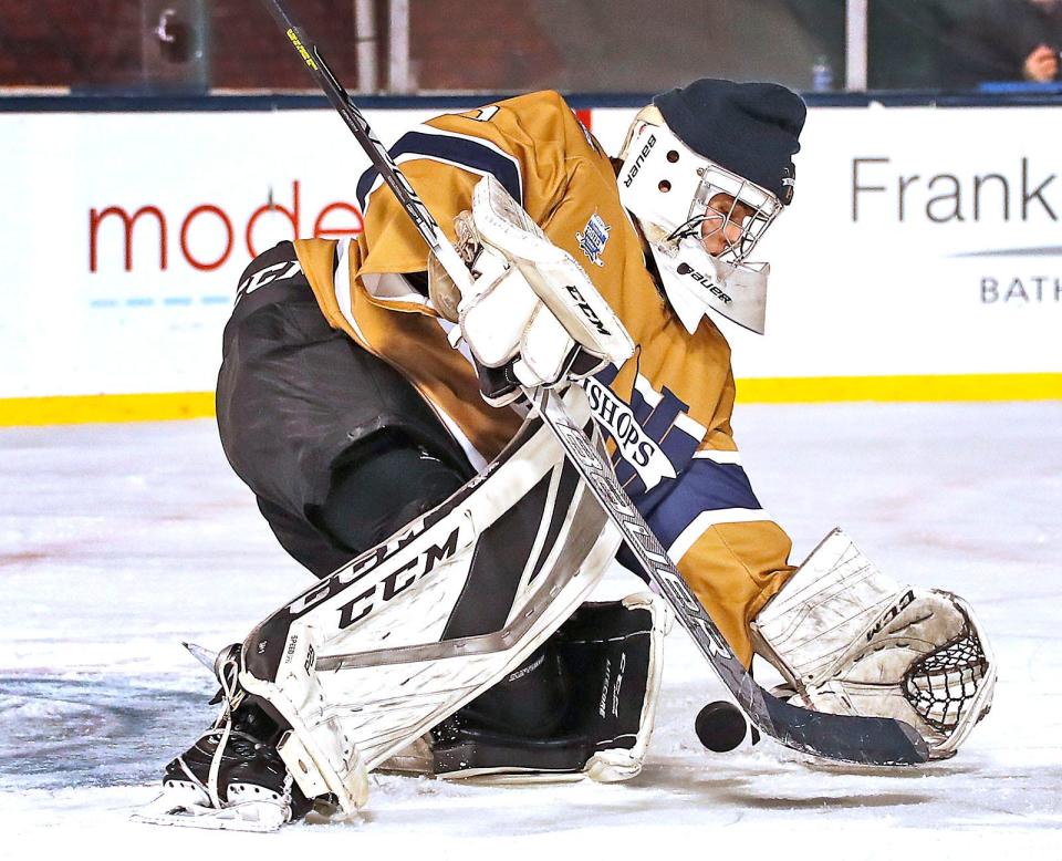 Archbishop Williams High boys hockey goalie Cole Sweet, of Avon, makes a save and covers the puck during a scrimmage against Bishop Fenwick at Fenway Park on Tuesday, Jan. 10, 2023. High school teams across the state got a chance to play on the ice after the NHL Winter Classic last week.