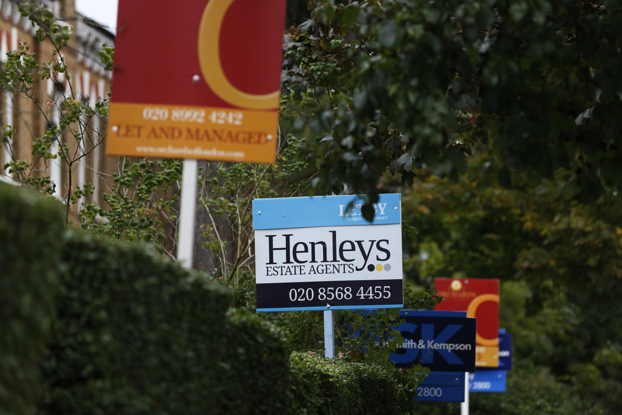 Estate agent signs outside houses offered for sale and rent, in London, Tuesday, Oct. 8, 2013. Britain's government launched on Tuesday a 12 billion-pound ($19 billion) program to help first-time homebuyers, a landmark plan that tries to offset banks' reluctance to lend but which critics argue could create a new property bubble. (AP Photo/Lefteris Pitarakis)