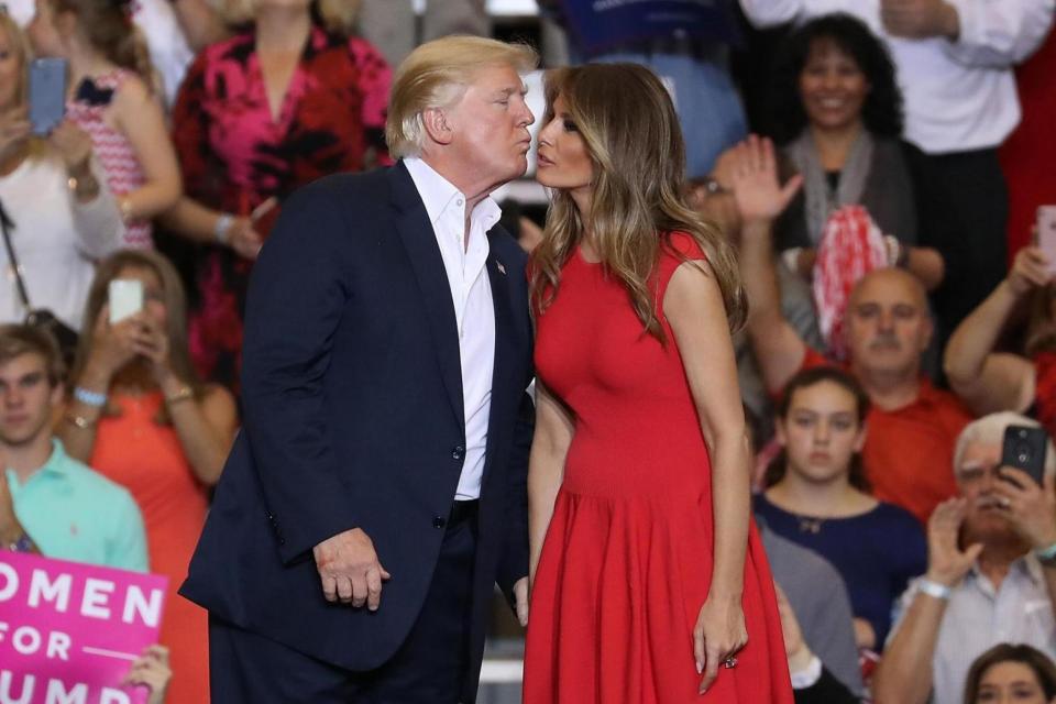 Donald Trump kisses wife Melania during the rally in Florida (Getty Images)