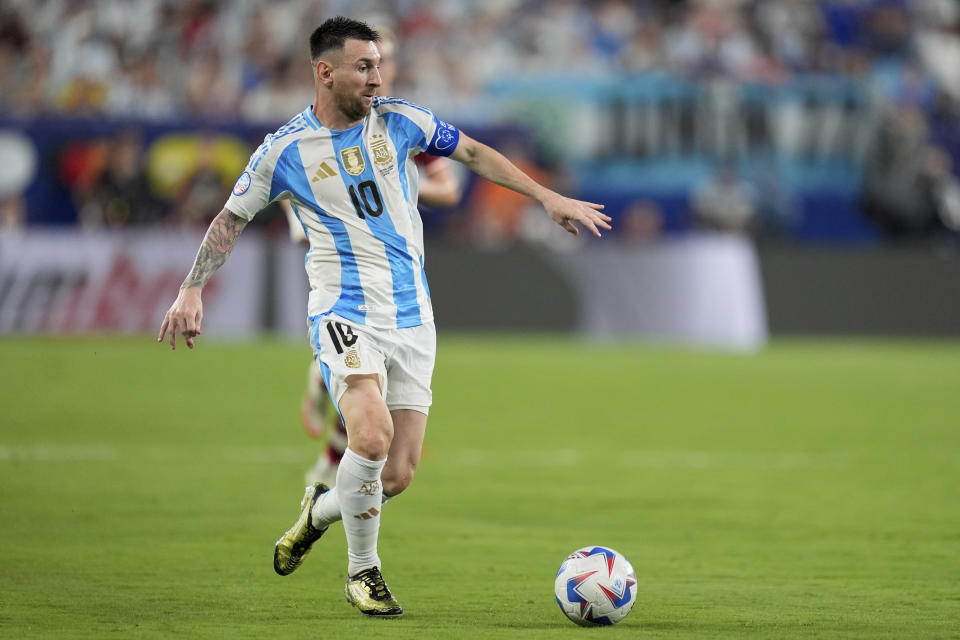 Argentina's Lionel Messi dribbles during a Copa America semifinal soccer match against Canada in East Rutherford, N.J., Tuesday, July 9, 2024. (AP Photo/Julia Nikhinson)