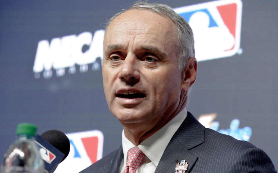 FILE - In this Thursday, June 21, 2018, file photo, Major League Baseball commissioner Rob Manfred speaks during a news conference in Omaha, Neb. Manfred doesn't foresee any problems if the World Series winner is invited to make the traditional visit to the White House. Manfred also says he is less concerned about lengthy games in the postseason than he is during the season. (AP Photo/Nati Harnik, File)
