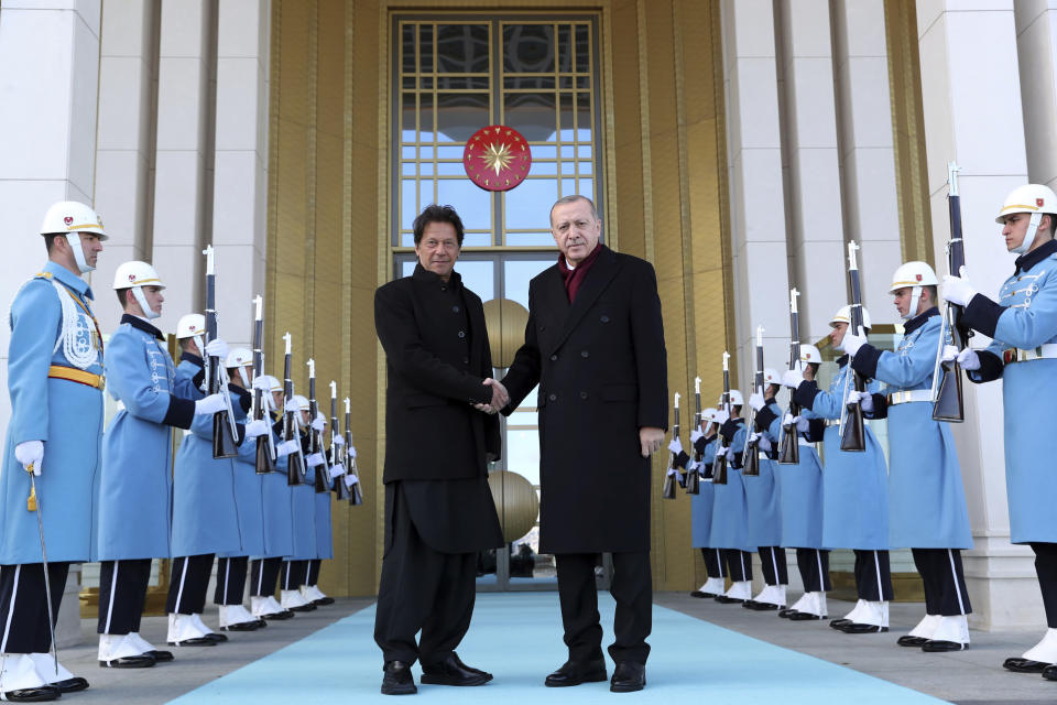 Turkey's President Recep Tayyip Erdogan, right, welcomes Pakistan's Prime Minister Imran Khan to Ankara, Turkey, Friday, Jan. 4, 2019. The two expected to discus bilateral and regional issues. (Presidential Press Service via AP, Pool)