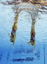Marie-Pier Boudreau Gagnon and Elise Marcotte of Canada compete during women's duet synchronized swimming preliminary round at the Aquatics Centre in the Olympic Park during the 2012 Summer Olympics in London, Monday, Aug. 6, 2012. (AP Photo/Mark J. Terrill)