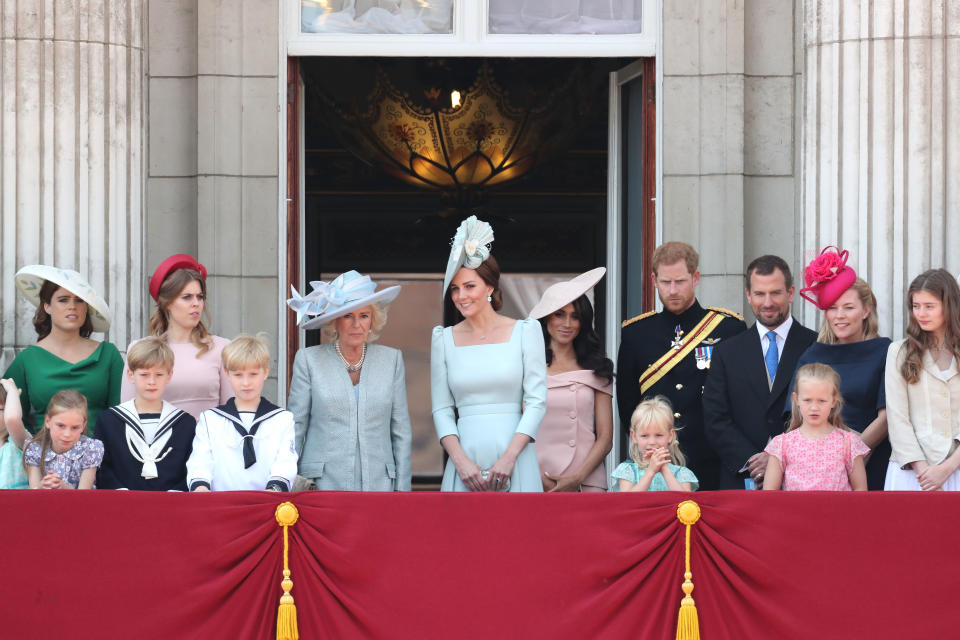 (From left to right) Princess Eugenie, Princess Beatrice, Camilla, Duchess Of Cornwall, Kate Middleton, Duchess of Cambridge, Meghan Markle, Duchess of Sussex, Prince Harry, Duke of Sussex, Peter Phillips, Autumn Phillips, Isla Phillips and Savannah Phillips on the balcony of Buckingham Palace during Trooping The Colour on June 9, 2018 in London, England