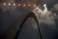 <p>In this multiple exposure photograph, the phases of a partial solar eclipse are seen over the Gateway Arch on Monday, Aug. 21, 2017, in St. Louis. The Gateway Arch was just a few miles outside of the path of totality. (Photo: Jeff Roberson/AP) </p>