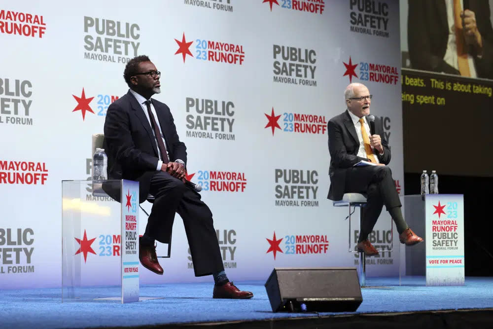 Chicago mayoral candidates Brandon Johnson, left, and Paul Vallas participate in a public safety forum in Chicago, Tuesday, March 14, 2023. (AP Photo/Teresa Crawford)