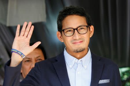 Sandiaga Uno, who is the vice-presidential candidate for Prabowo Subianto, waves after delivering a media briefing about taking the election result for a constitutional court challenge, in Jakarta, Indonesia, May 24, 2019. REUTERS/Willy Kurniawan