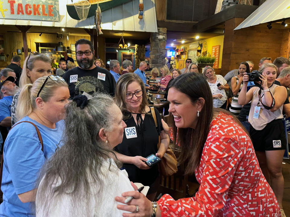 Former White House Press Secretary Sarah Sanders greets supporters at an event for her campaign for governor at a Colton's Steak House in Cabot, Ark., Friday, Sept. 10, 2021. (AP Photo/Andrew DeMillo)