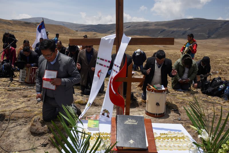 Bolivians gather at the Incachaca dam to pray for rain, on the outskirts of La Paz