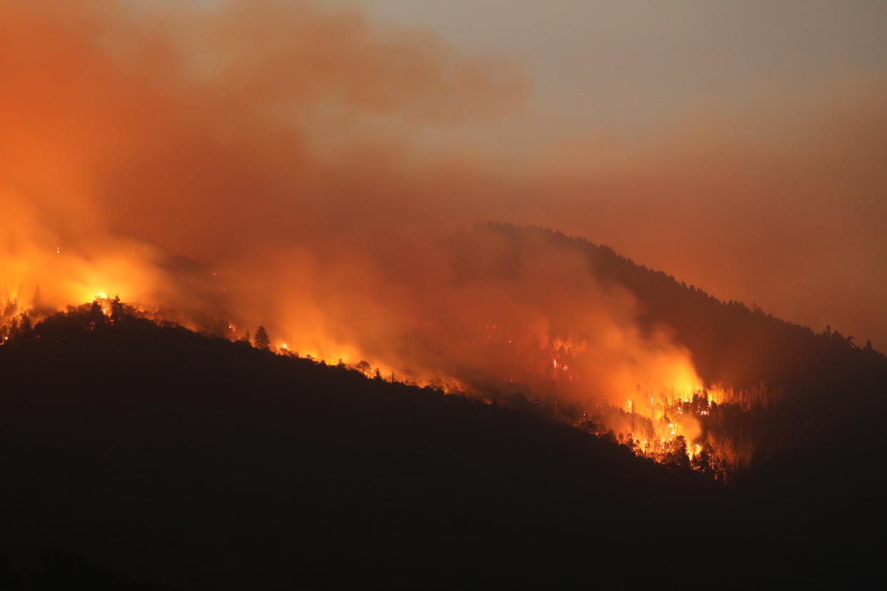 Burning trees from wildfires and smoke cover the landscape in California, U.S. Photographer: David Swanson/Bloomberg