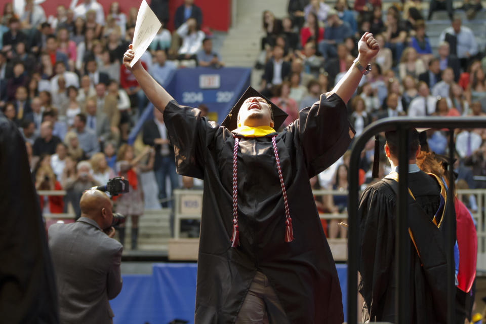 A student celebrates the joy of accomplishment at his UPenn Wharton undergraduate graduation ceremony (Wharton/Flickr)