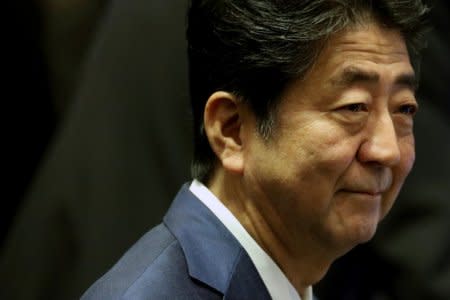 FILE PHOTO: Japan's Prime Minister Shinzo Abe attends the ASEAN Plus Three (APT) Summit in Singapore, November 15, 2018. REUTERS/Athit Perawongmetha