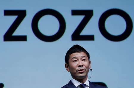 FILE PHOTO : Maezawa, the chief executive of Zozo, which operates Japan's popular fashion shopping site Zozotown and is officially called Start Today Co, speaks at an event launching the debut of its formal apparel items, in Tokyo