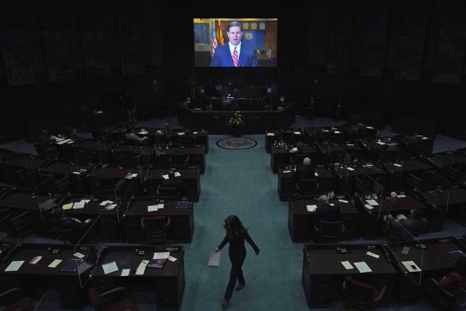 FILE - In this Jan. 11, 2021, file photo, Republican Gov. Doug Ducey delivers a remote state of the state address during the opening of the Arizona Legislature at the state Capitol in Phoenix. Irked by the sweeping use of executive orders during the COVID-19 crisis, state lawmakers around the U.S. are moving to curb the authority of governors and top health officials to impose emergency restrictions such as mask rules and business shutdowns. Republicans in the Arizona Senate want to end the broad emergency powers that Ducey has used to limit large gatherings and business capacities. (AP Photo/Ross D. Franklin, Pool, File)