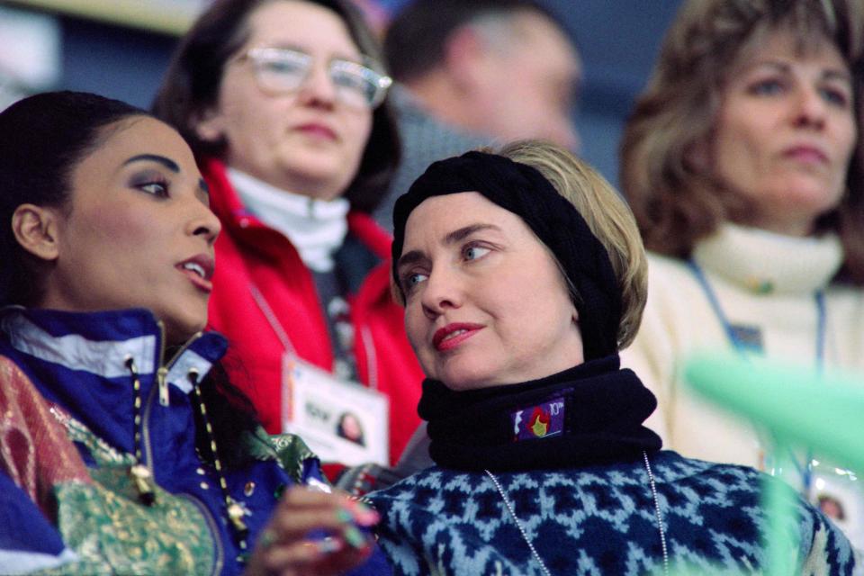 First lady Hillary Clinton speaks to American athlete Florence Griffith Joyner on Feb. 14, 1994, at the Olympic Hall during the 1994 Winter Olympics in Lillehammer, Norway.