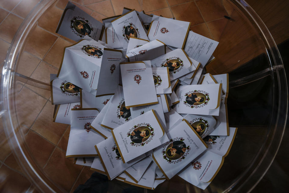 Petitions to St. Gabriele are left in a bowl at St. Gabriele dell'Addolorata sanctuary in Isola del Gran Sasso near Teramo in central Italy Sunday, June 18, 2023. (AP Photo/Domenico Stinellis)