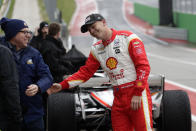 FILE - IndyCar driver Scott McLaughlin, right, jokes with his crew and visitors during IndyCar Series auto racing testing in Austin, Texas, in this Tuesday, Feb. 11, 2020, file photo. The IndyCar season begins with three new drivers for the season-opener at Barber Motorsports Park. Seven-time NASCAR champion Jimmie Johnson will be a 45-year-old rookie in a class that includes Romain Grosjean from Formula One and V8 Supercars champion Scott McLaughlin.(AP Photo/Eric Gay, File)