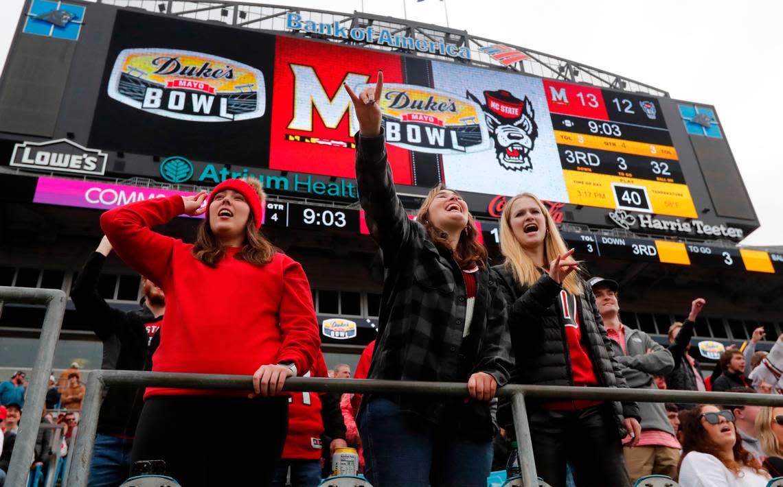 Fans cheer on the Wolfpack during the second half of Maryland’s 16-12 victory over N.C. State in the Duke’s Mayo Bowl at Bank of America Stadium in Charlotte, N.C., Friday, Dec. 30, 2022.