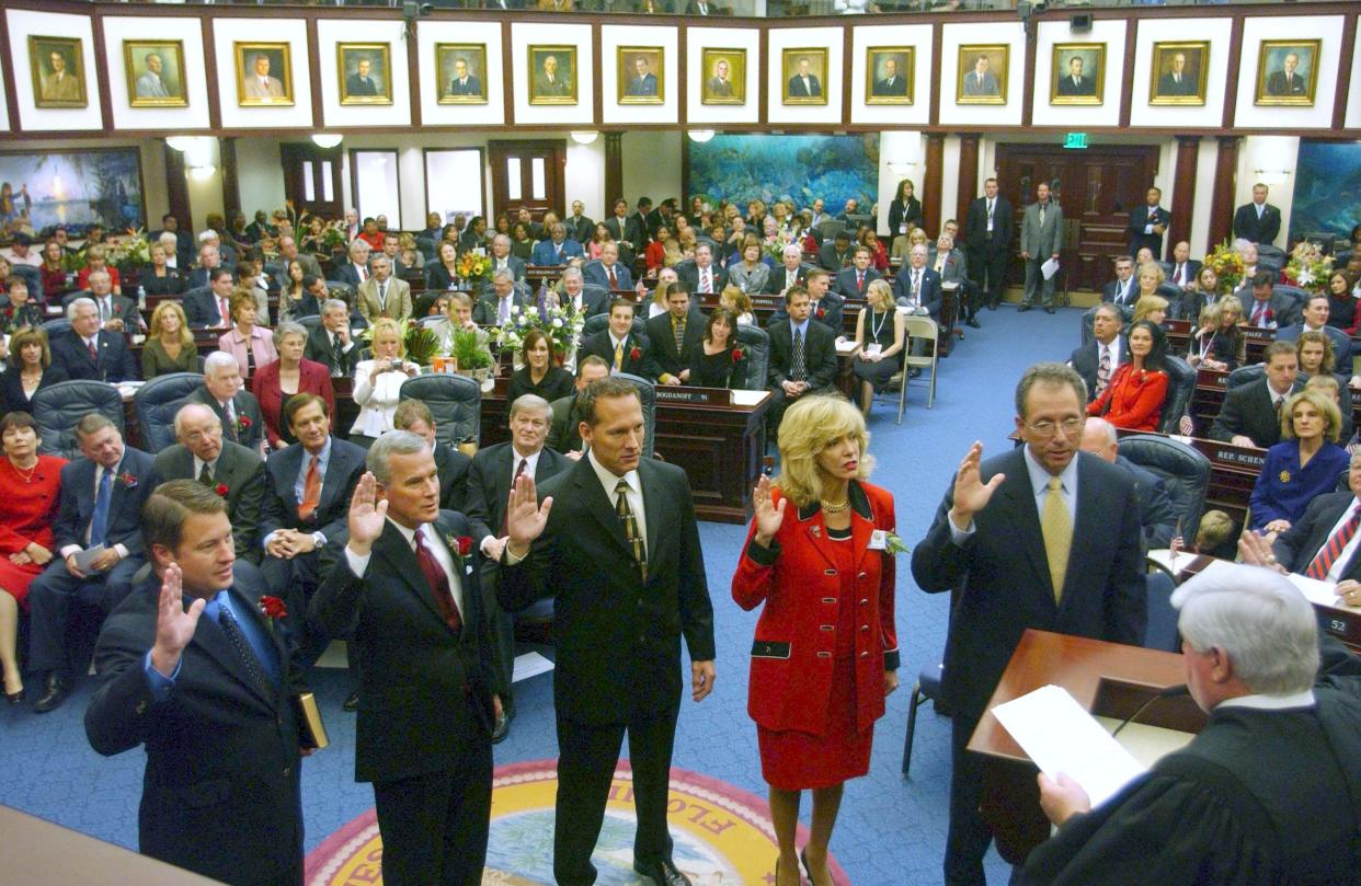 Newly-elected members take their oath of office from Supreme Court Chief Justice R. Fred Lewis, center, during Organization Session of the House of Representatives Tuesday, Nov. 21, 2006, in Tallahassee, Florida. From the left are: Nick Thompson, R- Dist. 73; Garrett Richter, R-Dist. 76; Gary Aubuchon, R-Dist. 74; Maria Sachs, D-Dist. 86; and William Snyder, R-Dist. 82.