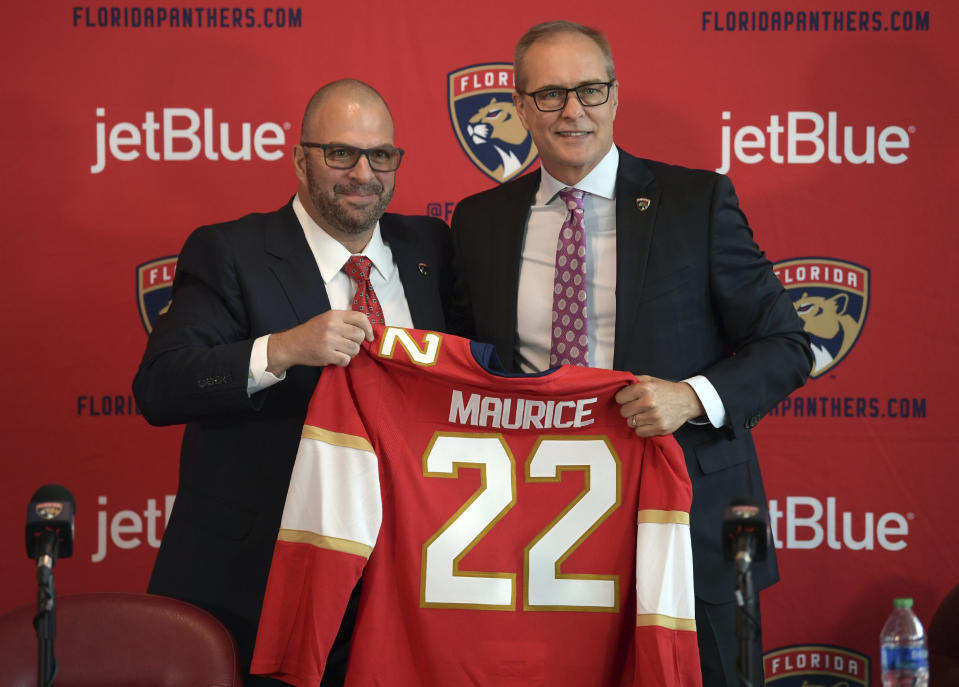 FILE - Paul Maurice, right, is introduced as the new head coach of the Florida Panthers by general manager Bill Zito, during an NHL hockey news conference at FLA Live Arena, Thursday, June 23, 2022, in Sunrise, Fla. Florida Panthers general manager Bill Zito has his team in position to have the best record in the NHL for the second time in three years. And his four seasons in Florida have arguably been the best four-year run in team history. (AP Photo/Jim Rassol, File)