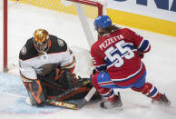 Montreal Canadiens' Michael Pezzetta, right, moves in on Anaheim Ducks goaltender Anthony Stolarz, left, during second-period NHL hockey game action in Montreal, Thursday, Jan. 27, 2022. (Graham Hughes/The Canadian Press via AP)