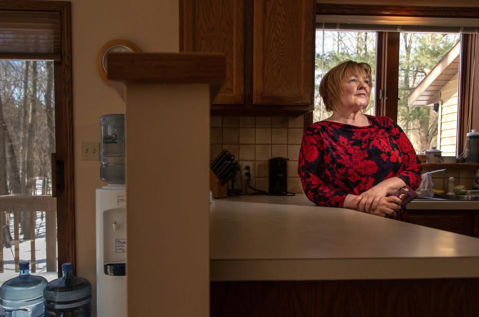 Sandy Wynn-Stelt, of Belmont, stands in her home on Monday, March 11, 2019. Wynn-Stelt lives across the street from the former House Street landfill, where Wolverine Worldwide dumped its PFAS-containing waste for decades. The DEQ informed her in 2017 that her well water had PFAS contamination as high as 78,000 parts per trillion. She has sky-high levels in her blood and her husband died of cancer over the past few years, leaving her wondering whether it's related.